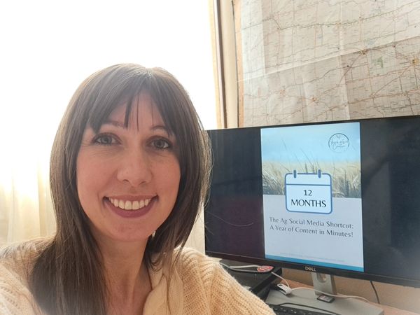 Laura Fernandez by computer screen with the Ag Social Media Shortcut: A Year of Content in Minutes!