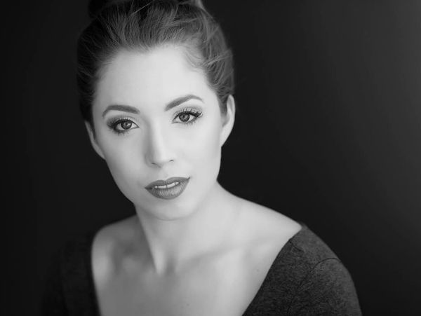 Black and white portrait of a woman with an elegant expression.