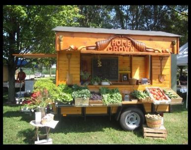 A mobile farmer's market stand labeled Home Grown.
