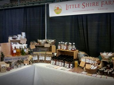 Farm produce and preserves display at Little Shire Farms booth.