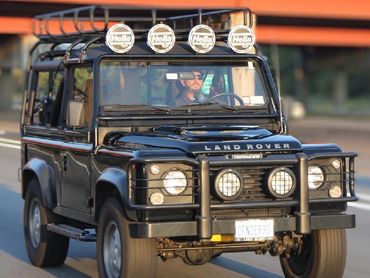 Rolling shot of the 1997 Land Rover Defender 90 on the Long Island Expressway heading to an event.