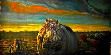A dramatic sunset scene with hippos in a river.