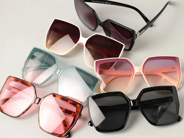 Six pairs of stylish, oversized square sunglasses in various colors.
