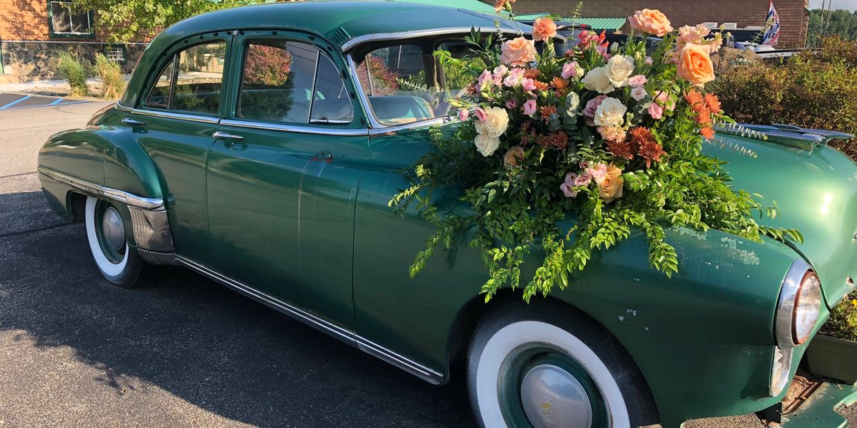 Show off your flowers on our green car at our barn venue near Monroe NY