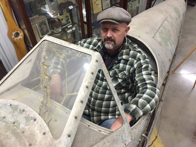 Jason Barnett sitting in Cimarron 83 in the exact seat where Lt. Thomas E. Bullington flew her. 