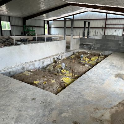 Interior concrete demolition in Houston TX warehouse with slab removal 