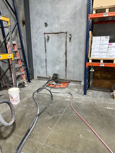 Interior slab sawing in Houston TX warehouse for precision concrete floor cutting and trench removal
