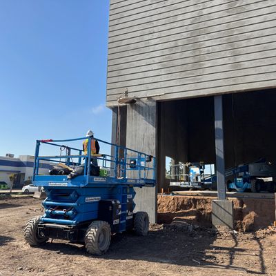 Commercial concrete job site in Houston TX with crew working equipment
