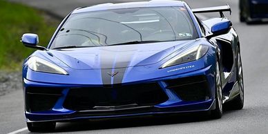 Blue sports car on the road.