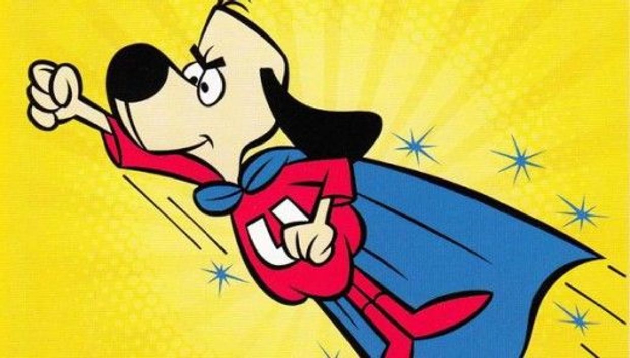 Superhero dog flying with a fist forward.