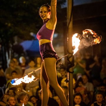 Cincinnati Queen City Stunt Circus professional entertainment performer fire staff crowd spinning