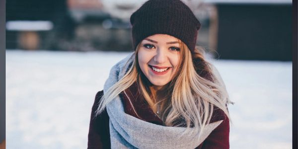 woman smiling in snow