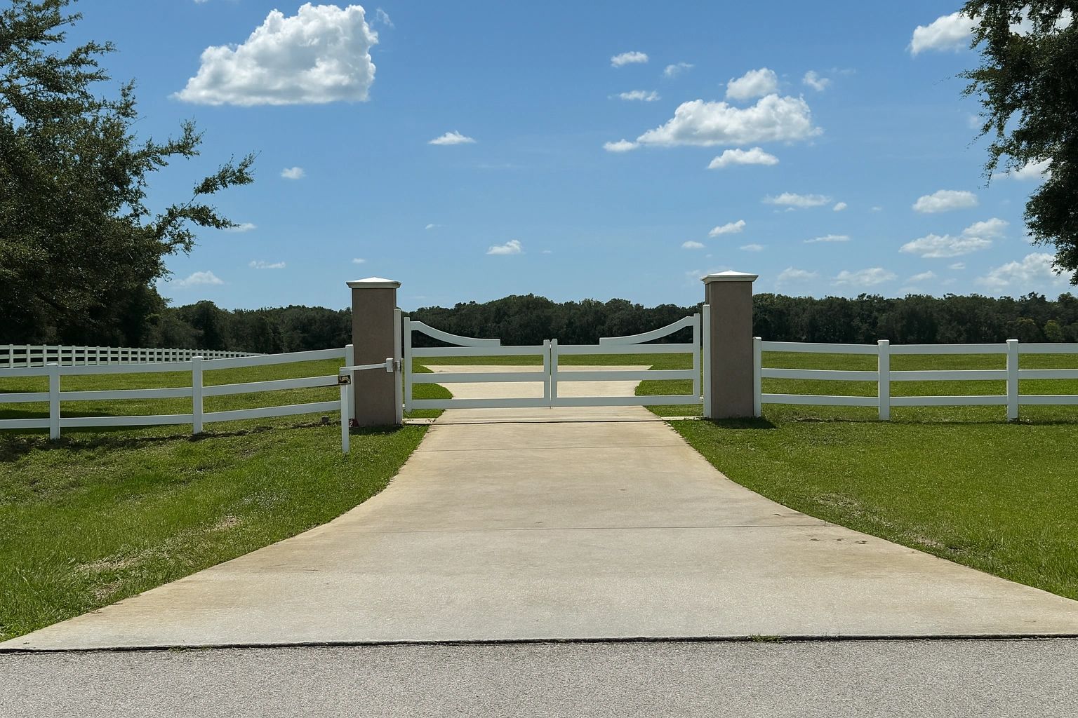 Fabric8ed fabricated custom welded and installed driveway gate with automatic operator in Groveland