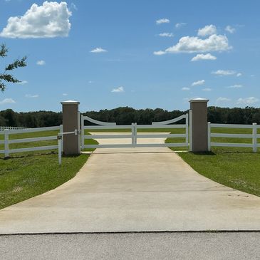 Fabric8ed custom driveway gate with operator in Groveland Florida