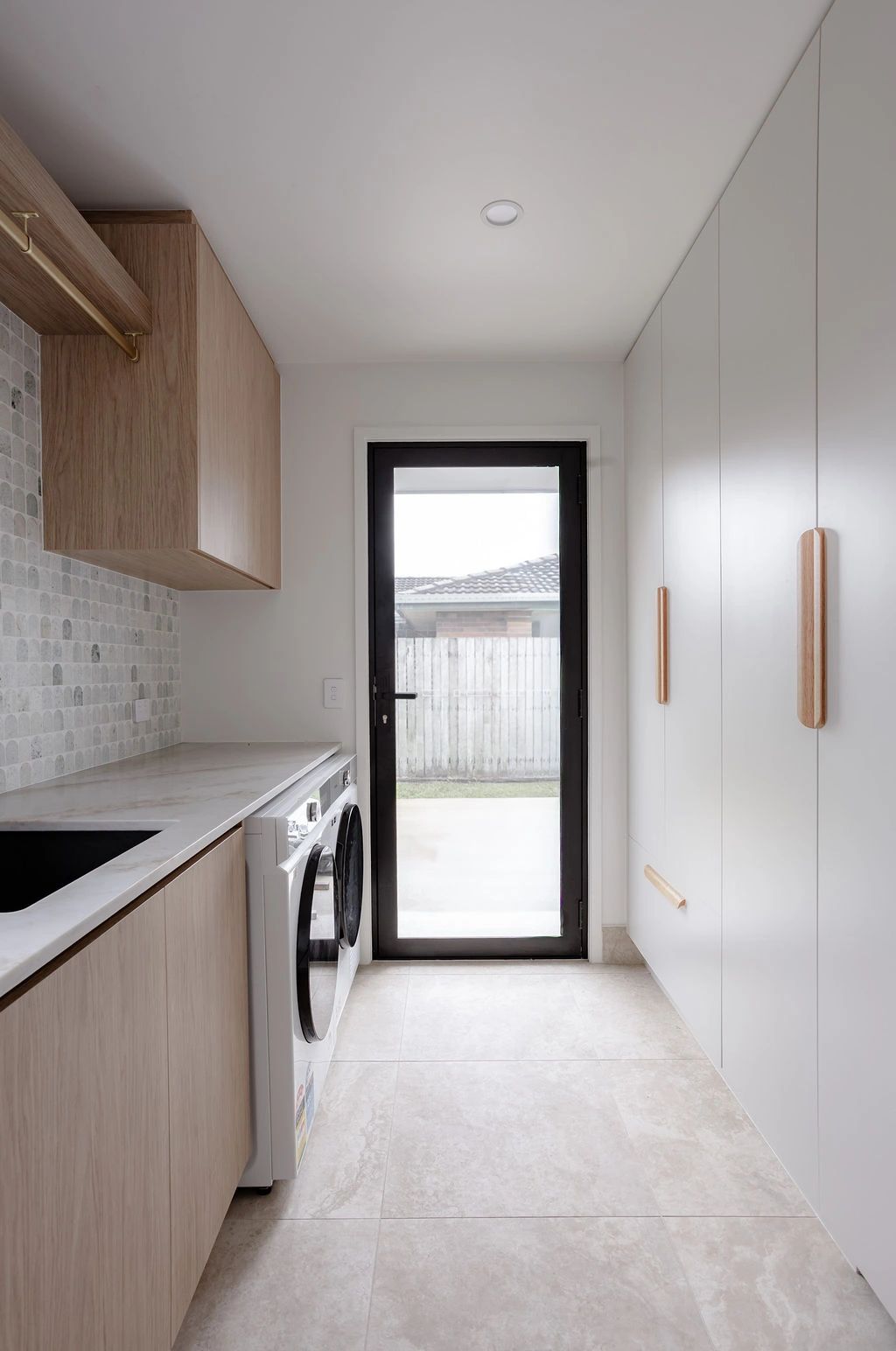 Modern laundry room with washer and dryer.