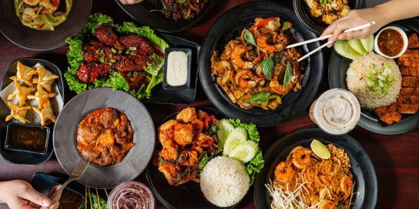 Variety of Asian dishes served on a table.
