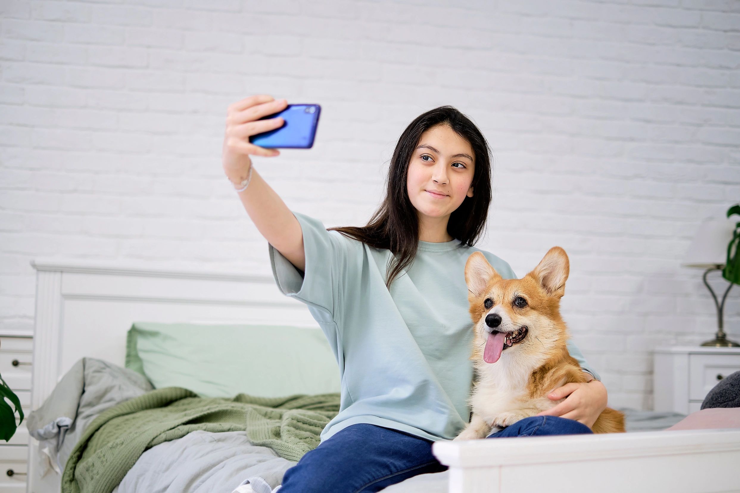 Girl and corgi selfie