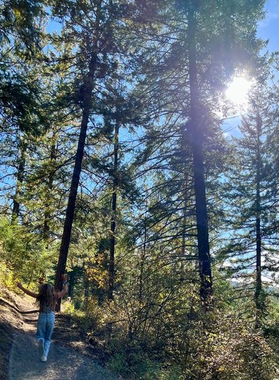 Little girl running on mountain trail