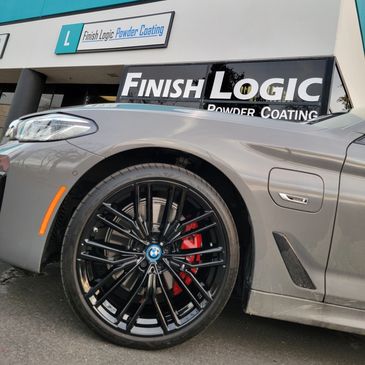 BMW 540e in front of the Finish Logic, Inc. building. The wheels are powder coated Gloss black.