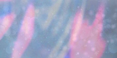 Abstract blurry image with pink and blue hues and light bokeh effects.