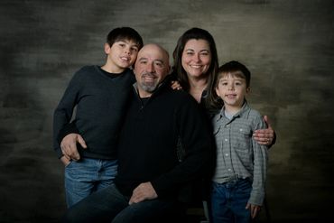 family portrait of four in a studio 