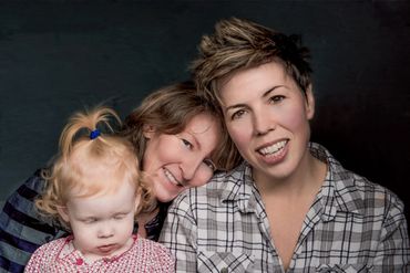 Toronto portrait of a family of three in a studio setting