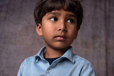 Five year old boy with a serious expression