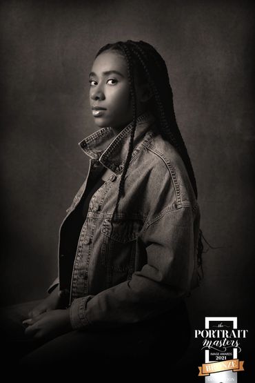 B&W portrait of a young black girl in a studio