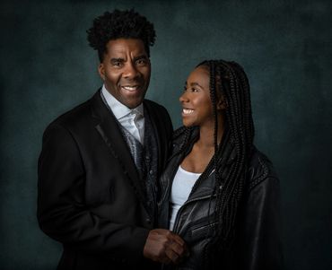 family portrait of a father and daughter in a studio