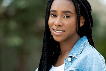 branding headshot of a black woman on location outside