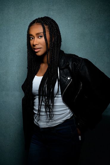 branding headshot of a young black woman in a studio