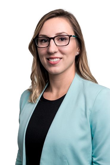 Business headshot of a young women with a white background