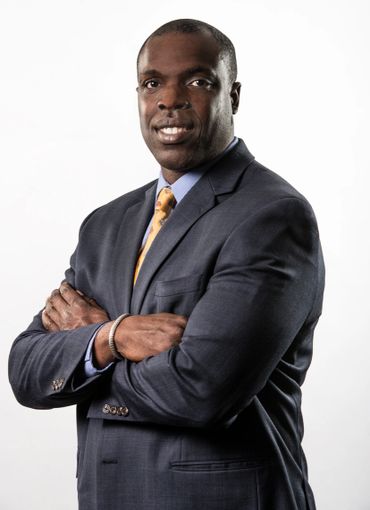 executive headshot of a man in a suit on a white background