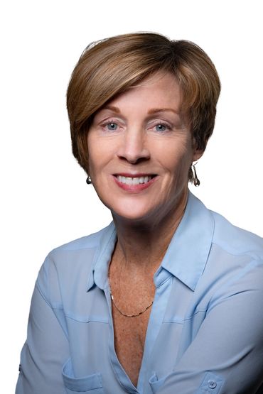 realtor headshot of a woman in a studio