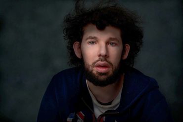 moody fine art portrait of a young man