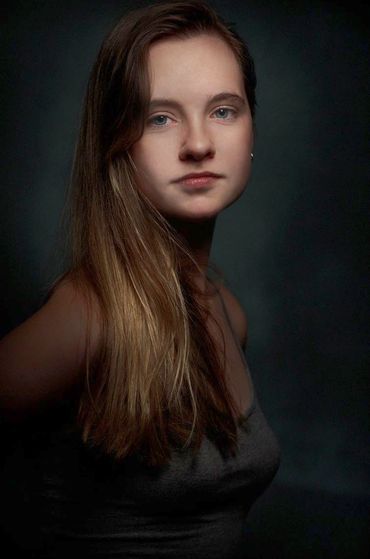 fine art portrait of a young woman in a studio