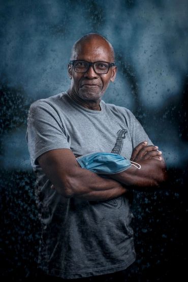 Older African Canadian man on a blue background