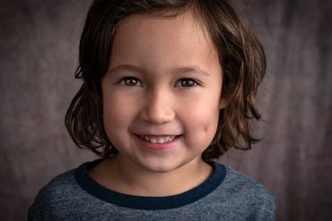 Studio portrait of a smiling four year old boy