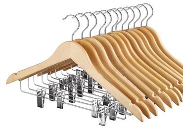 Set of wooden hangers with metal clips for versatile clothing storage.