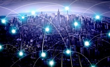City skyline with digital network connections.