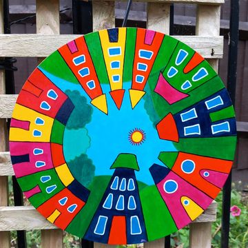Circle wood board with colourful abstract houses