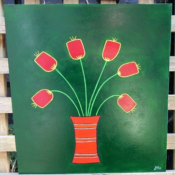 Wooden drawer bottom, green background with orange vase filled with red flowers