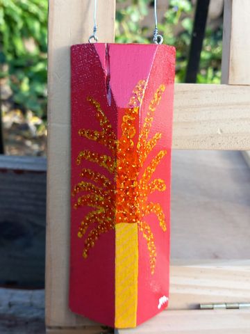 triangular piece of oak, red background, yellow vase and red & yellow flowers