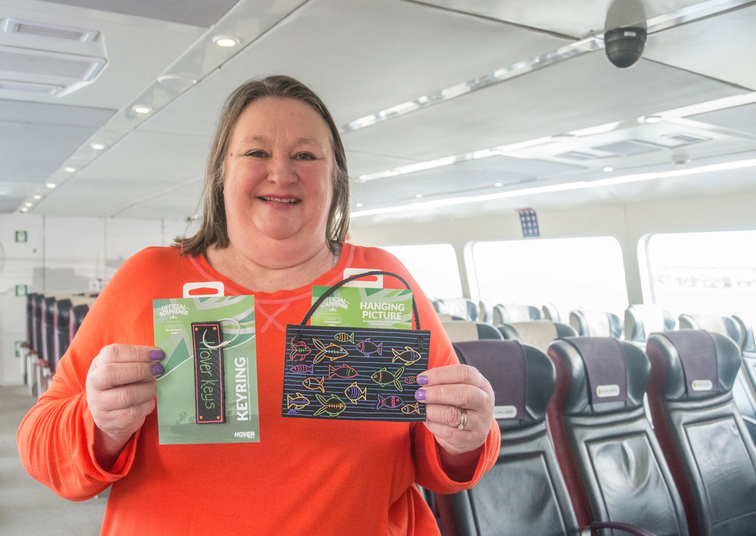 Picture of Jayne Myles, bymrsm onboard the hovercraft with some Hovergreen Souvenirs