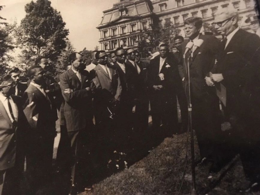 Winslow G. Carrington, one of the "small men" in the picture with President John F. Kennedy in 1961