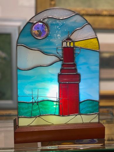 Algoma Beacon lamp featuring wire work, a cherry wood base, and trichroic jewel.  