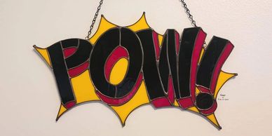 One-of-a-kind POW! stained glass suncatcher.  Available ONLY at Hey, I Thought of You in Chicago, Il