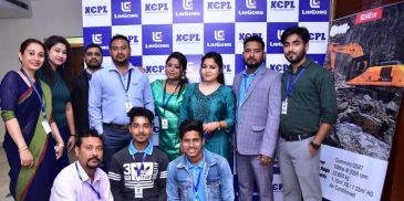 Group of people posing together indoors.