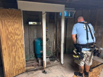 Interior Demo Bucks County PA Basement Demolition removing a water tank