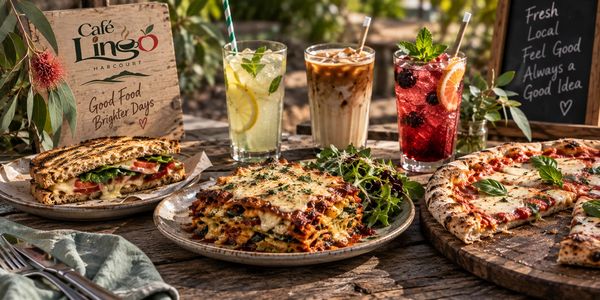 Delicious Italian meal with drinks on a wooden table.